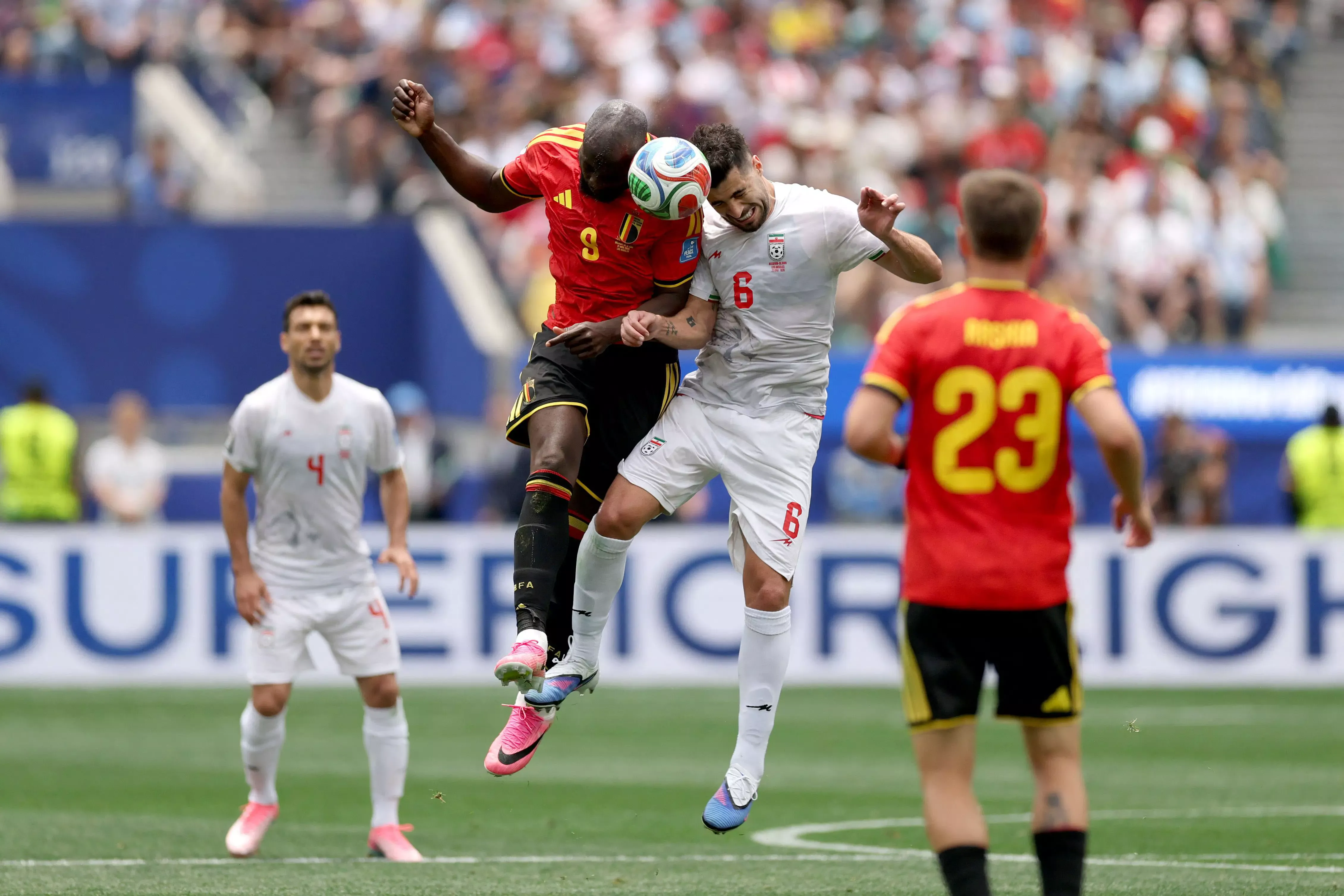 Romelu Lukaku of Belgium battles Saeid Ezatolahi from Iran for possession in the 2026 FIFA World Cup Group G tie at Los Angeles Stadium.