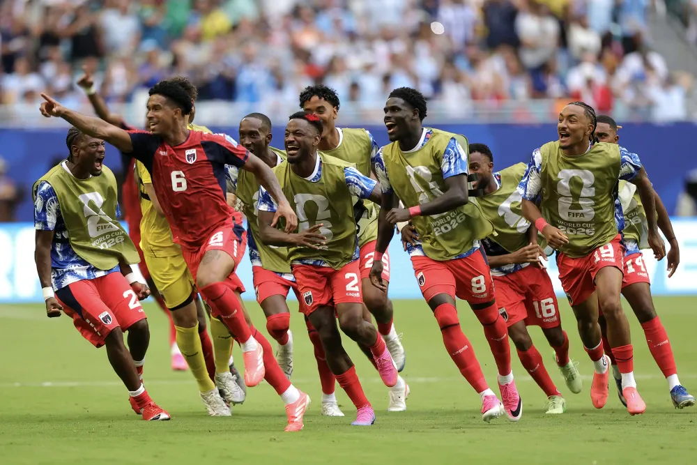 Kevin Pina and his Cape Verde teammates celebrate scoring the team's opening goal against Uruguay.