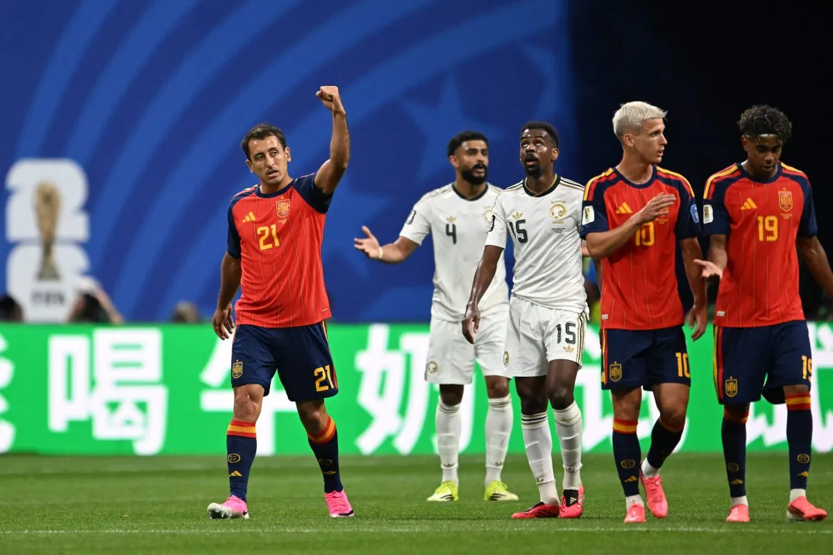 Left: Spain's No.21 Mikel Oyarzabal celebrates his second goal in the 2026 World Cup clash with Saudi Arabia at Atlanta Stadium, June 21, 2026.