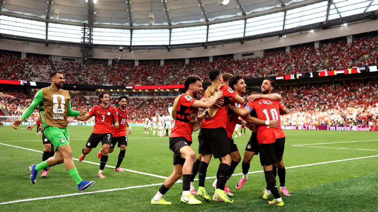 Joyous scenes as Egypt's squad celebrates their goal versus New Zealand at the World Cup.