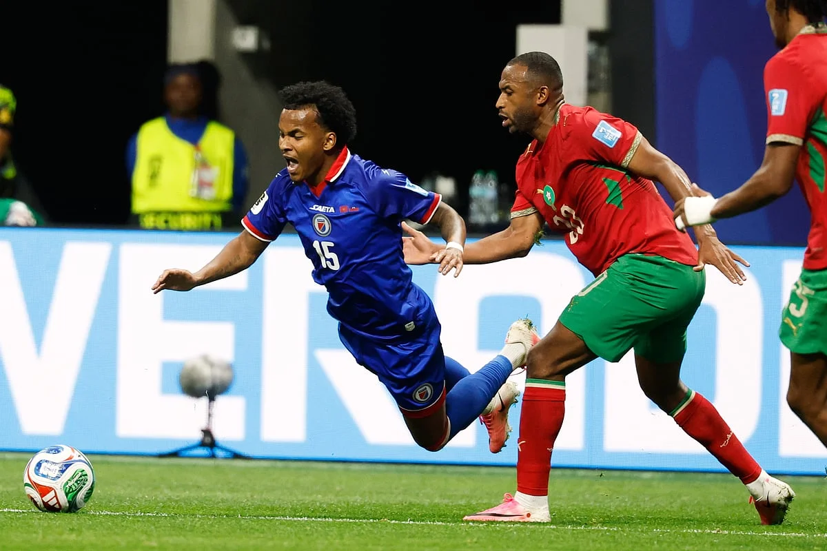 Morocco bench players celebrate the comeback victory against Haiti