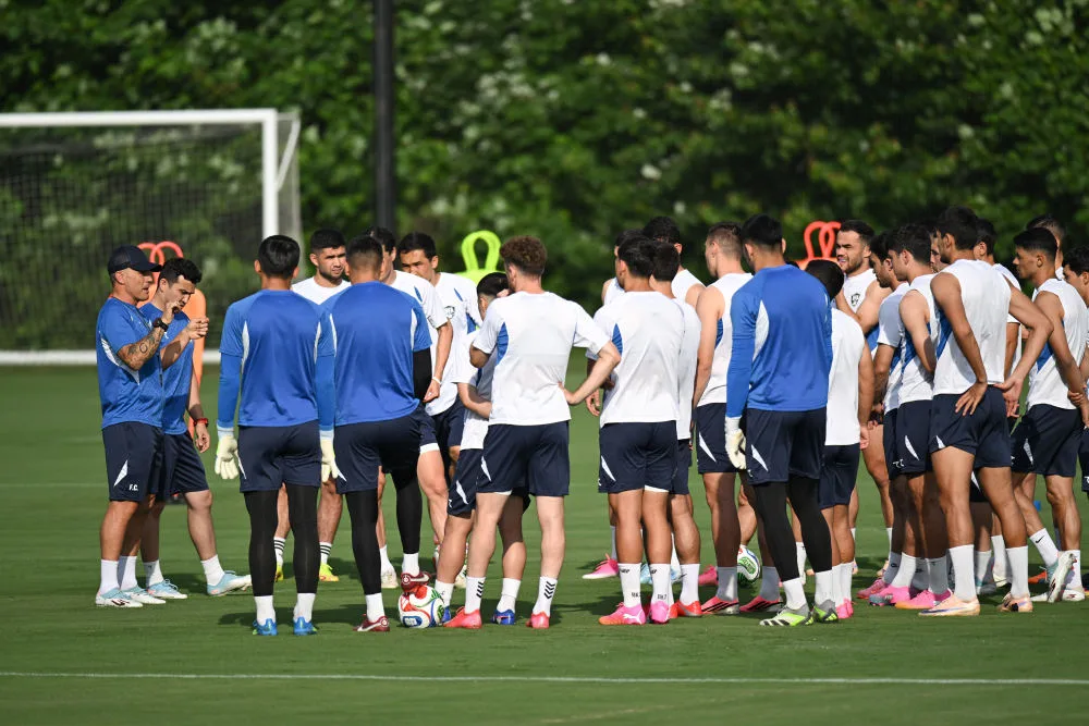 Head coach Fabio Cannavaro leads Uzbekistan's players through training