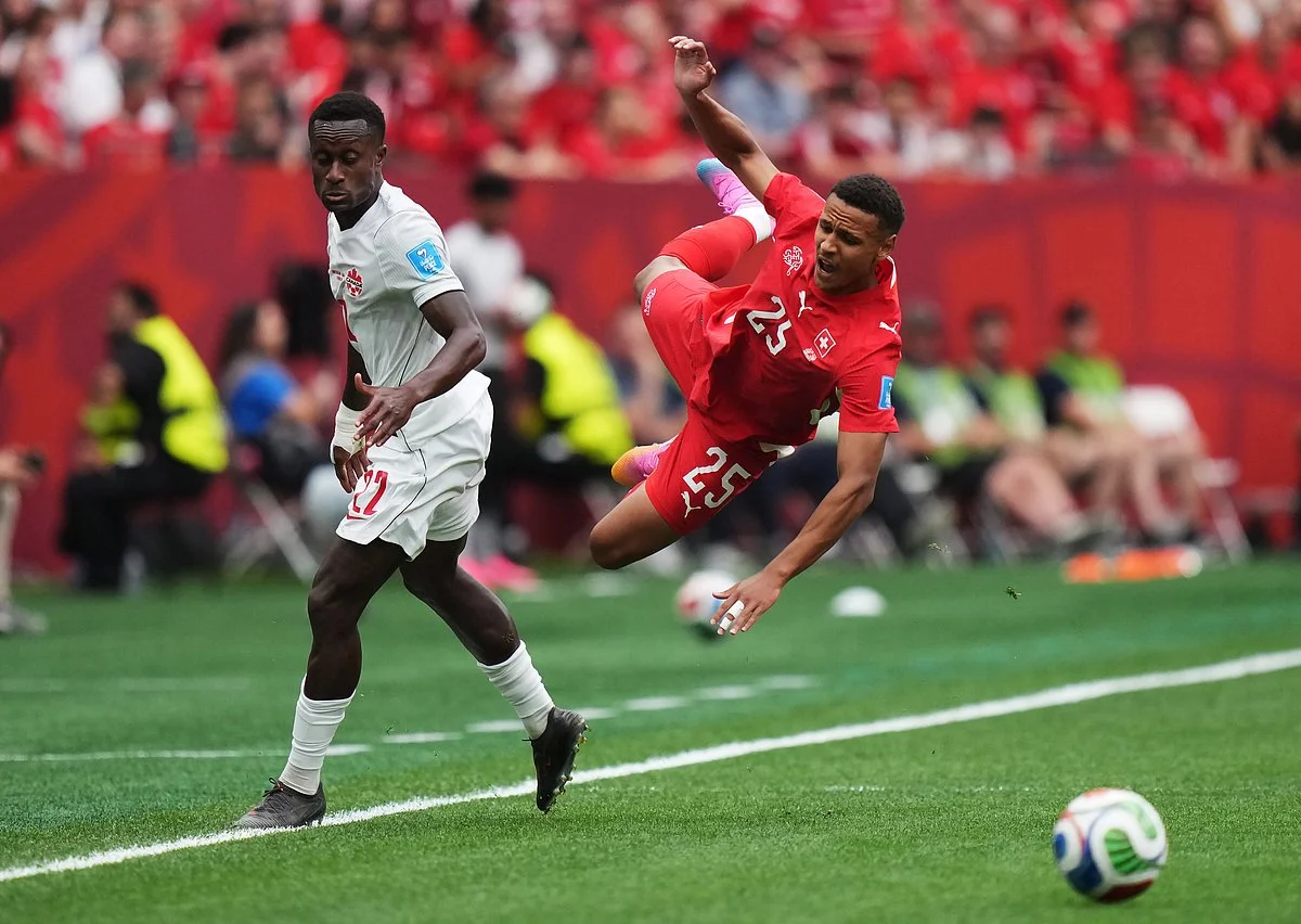 Canada's Promise David scores a header against Switzerland at BC Place during the 2026 World Cup Group B match