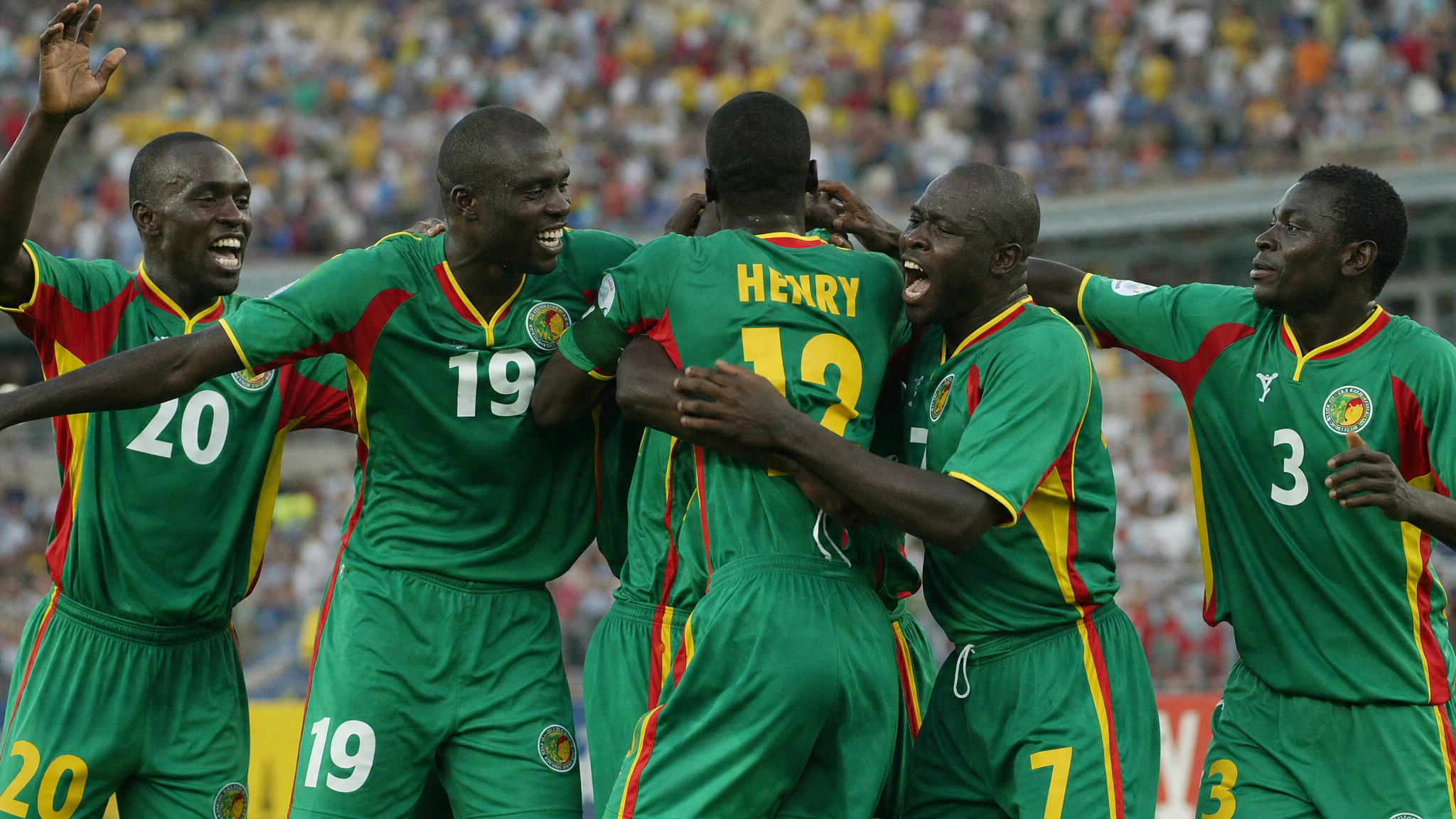 Senegal players celebrate their historic 1-0 victory over France in the 2002 World Cup opening match — debutants toppling the reigning world and European champions.
